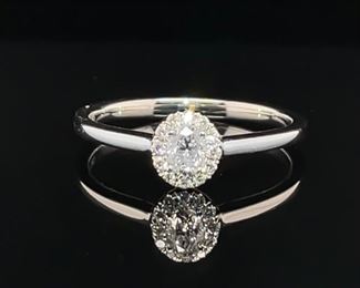 Brand New 1/4 Carat Diamond Halo Ring in 14k White Gold.