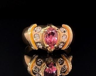 A magnificent 1.00 ctw. pink pear shaped natural Tourmaline is in the center of radiant bezel set diamonds. This designer style ring is set in 14k Yellow Gold and can set the sweet tone of the season.