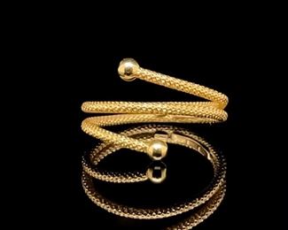 Textured 18k Italian gold is expertly designed to coil and spring around the wearer's finger; very elegant, very unique!
