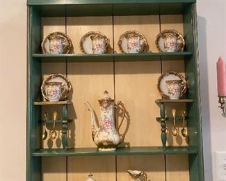 Beautiful antique shelf with demitasse Ardco China.