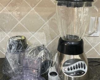 $25.00....................Oster Glass Blender with attachments (C130)
