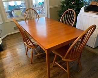 Dining table with 2 leaves and 8 chairs (4 captain, 4 side)