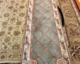 This fleur die Lis Wool Rug measures 120 inches x 30 inches