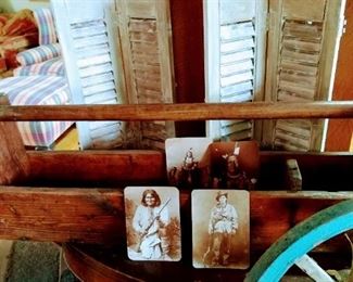 Vintage shutters, antique carpenter box, antique wheel and signed oil painting of Native American.