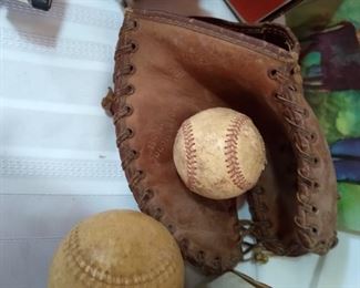 Vintage baseball mitt and base balls.
