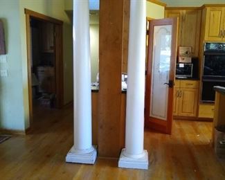 Two wood columns with capitals.