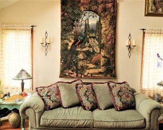 Sofa sleeper couch w tapestry pillows.