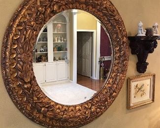 Large, round ornate mirror