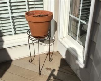 A lot of garden items and plant stands