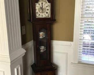 A beautiful grandmother clock.
