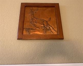 Hammered copper antelope leaping