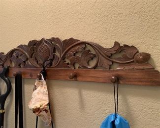 Carved wood coat rack