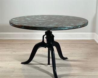 CUSTOM ADJUSTABLE COPPER TABLE | Probably Artesanos for Arhaus, impressed with makers signature - a Butterfly; hammered oxidized copper top on a wrought iron adjustable base, the table raises and lowers via a hand-crank, owner paid over $3,000 and waited six weeks for fabrication and delivery; h. 30 (adjustable) x 48 in. 