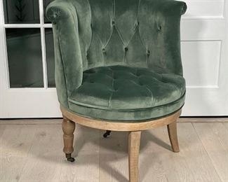 TOMMY HILFIGER TUFTED VELVET SWIVEL CHAIR | tufted green velvet, barrel back on a swiveling base with two casters on the rear wheels; h. 34 x 31 x 28 in. 