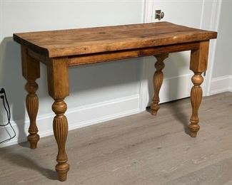 SUBSTANTIAL BESPOKE OLD BOARD TABLE | the top made with extra-thick planks of reclaimed wood, supported by a box frame with heavily carved and turned legs; h. 35 x 54 x 23 in. 