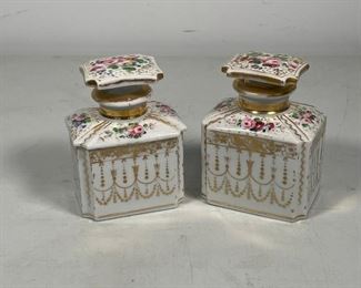 PAIR PAINTED PORCELAIN JARS | one with a stopper, the other with a faux-stopper lid made to match; h. 5-1/2 in. 