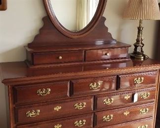 Dresser with oval mirror