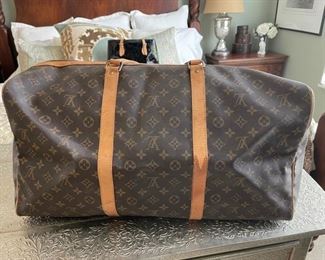 Louis Vuitton duffel bag 22in. X 10.5in x 12in