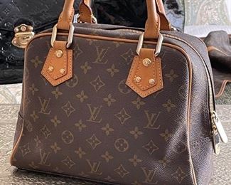 Louis Vuitton Monogram Manhattan PM purse	12in. X 9in. X 4.5in.