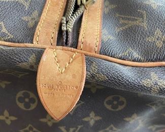 Louis Vuitton duffel bag	22in. X 10.5in x 12in