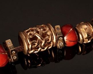 14K Yellow Gold 18” Charm Necklace	18 inch with varying sized charms