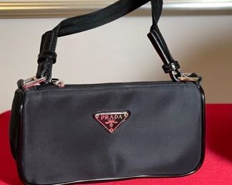 Authentic Sm Prada Clutch Purse in box	5x9.5x2.5in	HxWxD