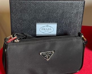 Authentic Sm Prada Clutch Purse in box	5x9.5x2.5in	HxWxD