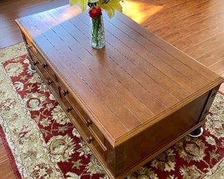 This is a beautiful coffee table with storage drawers.