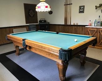 Stepeelton pool table with pool sticks, pool balls, rack, chalk and table top brush