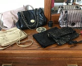 Many stylish purses/handbags