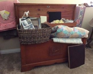 Lane cedar chest. Quilts. Vintage baby clothing.