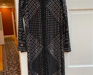 Luxurious, heavy jeweled coat by Michael Korrs size Medium with black sheath dress underneath $185