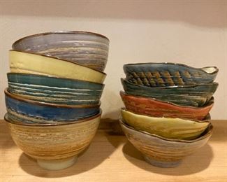 10 pottery bowls with various interior colors $45