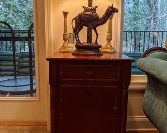 faux bamboo mahogany side table, with metal camel table lamp.