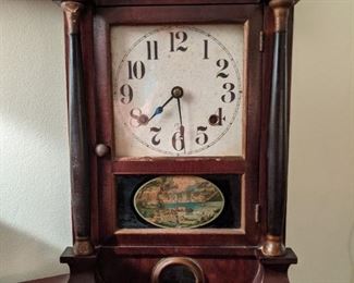 Antique mahogany "Biedermeier" case chiming clock, with key.