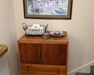 Antique English men's dresser, from Sympler Times, in McDonough, pewter shell dishes and box, wire basket, with hand towels and nicely framed/matted watercolor of the Fairmont Banff Springs Hotel, Banff, Alberta. 