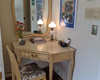 Corner desk and matching mirror, from the vintage French Provincial bedroom set, vintage Italian metal zinnias in pot and three pieces of original art. 