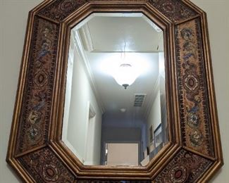 Vintage Italian gilt wood/reverse painted/beveled glass wall mirror.