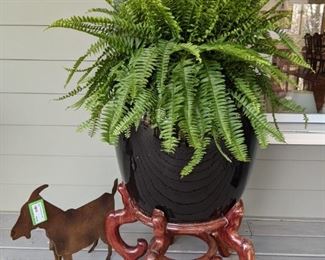 There's a pair of these glazed ceramic Asian urns on good wooden stands, both with fresh ferns, to give you authentic spring fever!