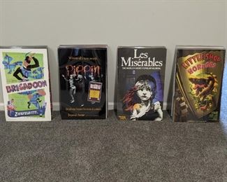 There are 22 of these plexiglass framed theater posters, come dig through them and find your favorites!
