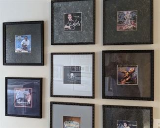 These are framed/autographed CD covers.