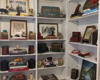 Nice collection of art, books, vintage cast iron toys, etc.