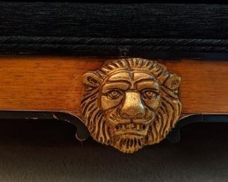 Carved gild wood lion's head detail.