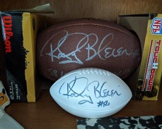 Two autographed footballs, by Rocky Bleier, #20, 4-time Super Bowl champion.                                                              Robert Patrick "Rocky" Bleier is an American former professional American football player. He was a National Football League halfback for the Pittsburgh Steelers in 1968 and from 1970 to 1980.