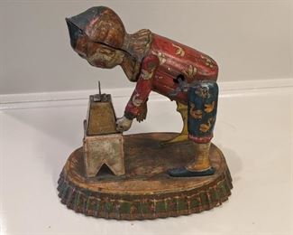 Antique German tin toy, strong man weightlifter, by Distler.