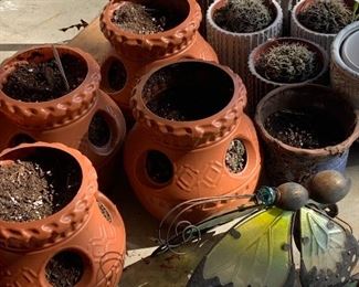Cactus (plastic) and ceramic succulent pots. 