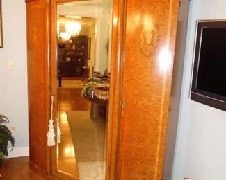 This item is gorgeous and very large.  Vintage Style French Armoire Cabinet, Beveled Mirrored Center Panel, interior shelves. (comes apart for moving)