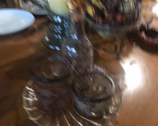 Sorry for posting this picture.  The actual crystal decanter and jars set is really nice!  Amber/smoky color with beautiful etching.  
Jars have metal bands. 