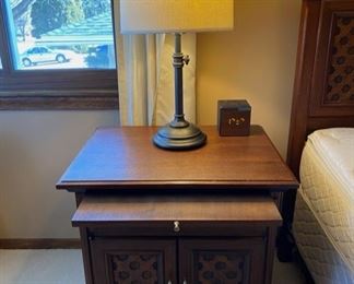 Mid Century Ricardo Lynn custom bedroom furniture in dark stained teak wood, with a Pottery Barn telescoping table lamp