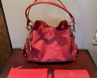 Very nice selection of newer Coach handbags and wallets, like this “Edie” Dark Rouge Shoulder Bag  model with keychain 